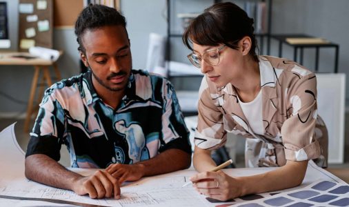 Architects working on floor plans for interior design